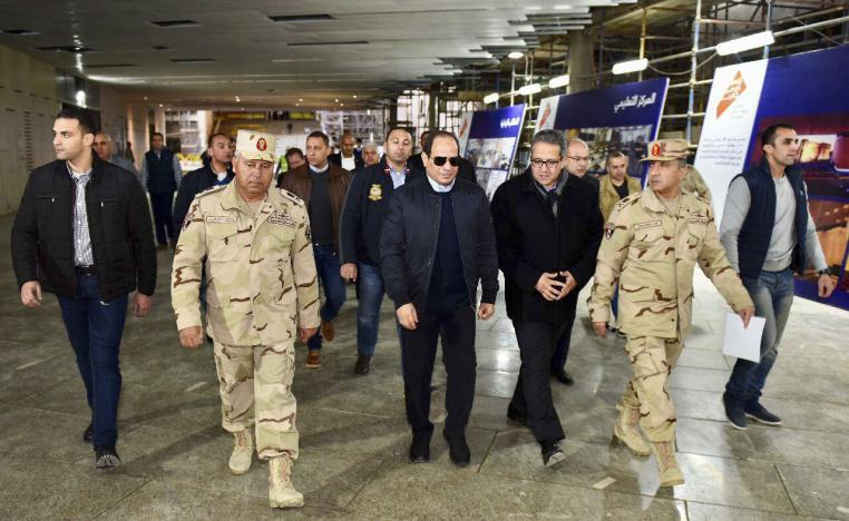 Egyptian President Abdel Fattah el-Sisi (C) inspects the progress of work during a tour of the Grand Egyptian Museum.