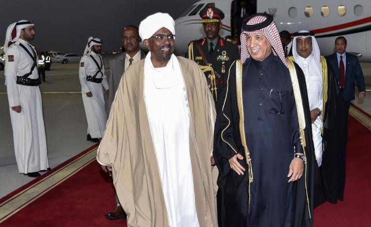 A handout picture released by the Qatar News Agency (QNA) on January 23, 2019 shows Sudanese President Omar al-Bashir (R) being received by Qatari Minister of State for Foreign Affairs Sultan bin Saad al-Muraikhi in Doha.
