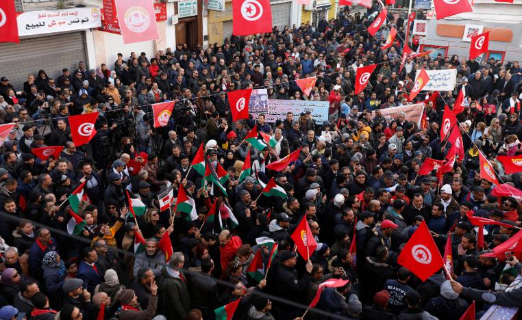People gather during a nationwide strike against the government's refusal to raise wages in Tunis, Tunisia January 17, 2019. 
