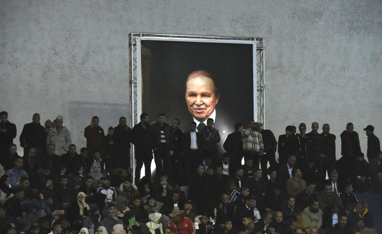 Supporters of Algferia's National Liberation Front (FLN) party, gather at La Coupole arena in the capital Algiers on February 9, 2019, to call upon the current President Abdelaziz Bouteflika (poster) to run for a fifth term in office.