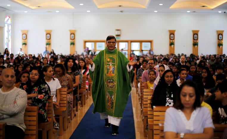 The expat bishop walks between the worshippers during the mass at St. Francis of Assisi Catholic Church in Jebel Ali, as Catholics are awaiting a historical visit by Pope Francis to the United Arab Emirates, in Dubai, UAE January 18, 2019.