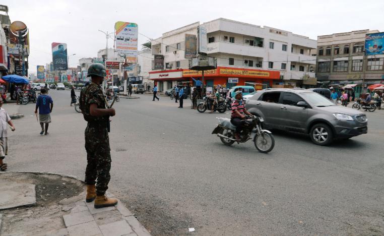 Police trooper stands guard on a street in the Red Sea port city of Hodeidah, Yemen February 13, 2019.