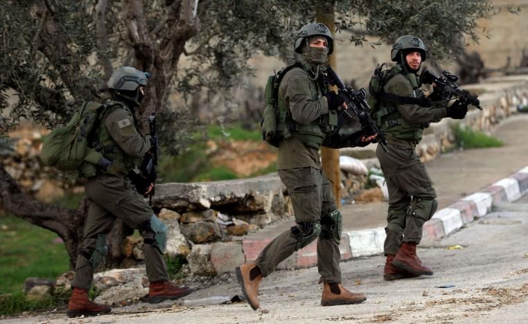  Israeli forces walk during a raid in Ramallah in the Israeli-occupied West Bank December 13, 2018.