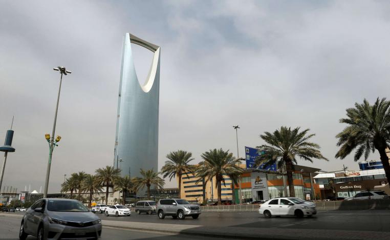 Cars drive past the Kingdom Centre Tower in Riyadh, Saudi Arabia, January 30, 2018.