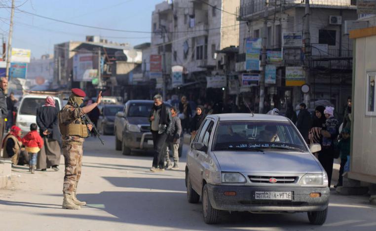 A member of Manbij Military Council gestures at a car in Manbij city, Syria December 29, 2018.