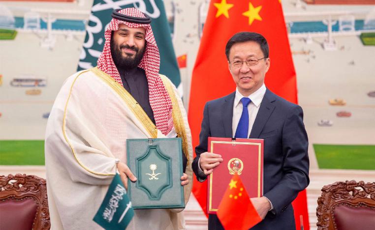 Saudi Crown Prince Mohammed bin Salman bin Abdulaziz Al Saud (L) and Han Zheng, Vice-Premier of the State Council of the People's Republic of China, pose for pictures during after the signing of memorandums of understanding at the Great Hall of the People in Beijing, China on 22 February 2019 . 