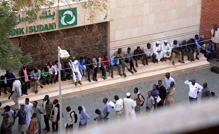 Many residents have to line up for hours to withdraw money