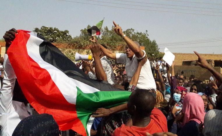 Sudanese protesters wave their national flag and chant slogans during an anti-government demonstration in the capital Khartoum's twin city of Omdurman on January 31, 2019.