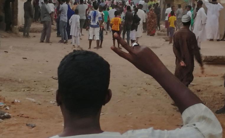 A Sudanese protester raises the victory sign during an anti-government demonstration in Khartoum on February 15, 2019.