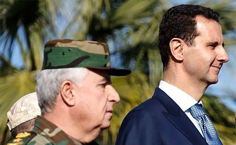 Syria's defence minister Ali Ayyoub with Bashar al Assad