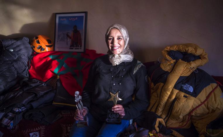 Moroccan mountaineer Bouchra Baibanou is pictured in her home with her trophies in the Sidi Moussa district of Sale near Rabat on November 29, 2018.