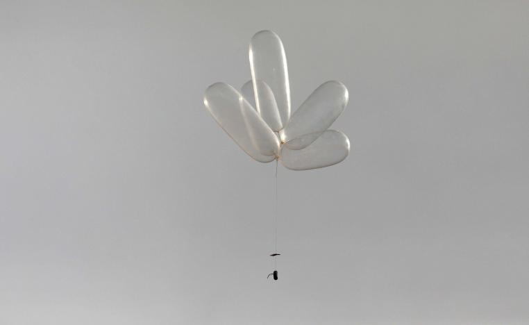 Balloons connected to a device can be seen as Palestinians protest near the fence separating the Gaza Strip on October 19, 2018.