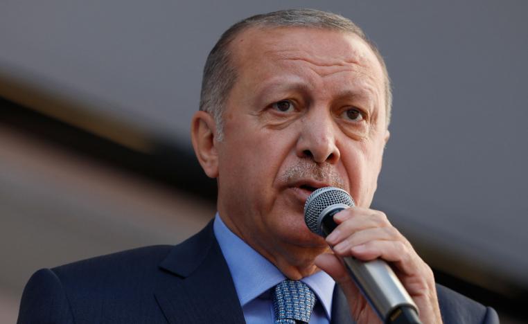 In this Thursday, March 14, 2019 photo, Turkey's President Recep Tayyip Erdogan addresses the supporters of his ruling Justice and Development Party, AKP, during a rally in Ankara, Turkey.