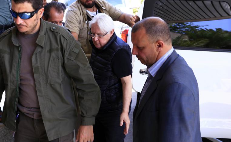 Martin Griffiths (C), the UN special envoy for Yemen, is surrounded by his personal security detail as he departs the Yemeni capital Sanaa on February 28, 2019 at the international airport.