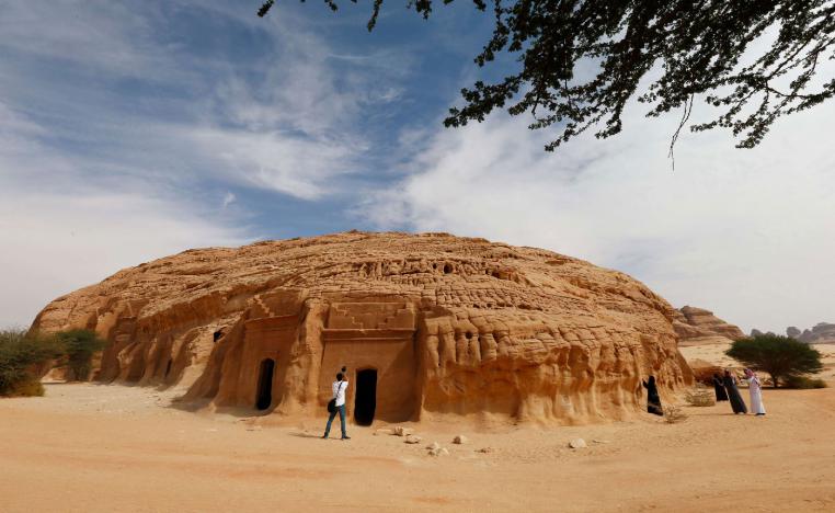 Visitors take pictures at majestic rock-hewn tombs of Madain Saleh near the city al-Ula, Saudi Arabia January 25, 2019. 