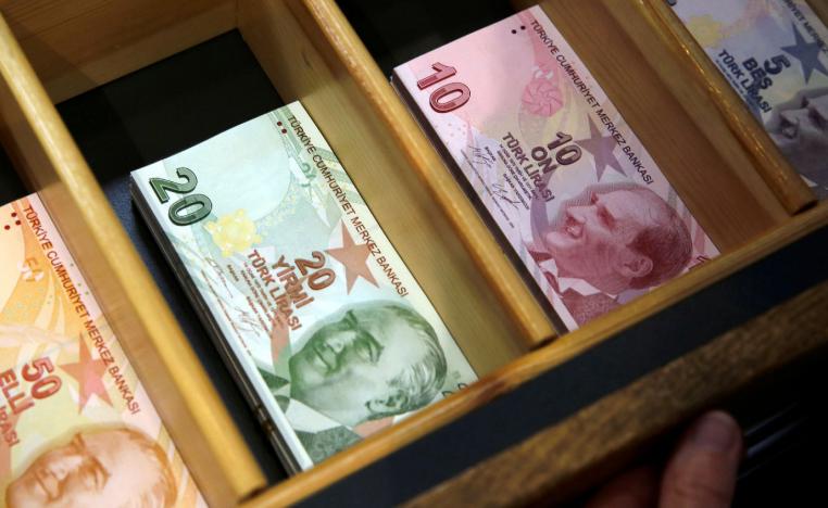 Turkish lira banknotes are pictured at a currency exchange office in Istanbul, Turkey August 13, 2018.