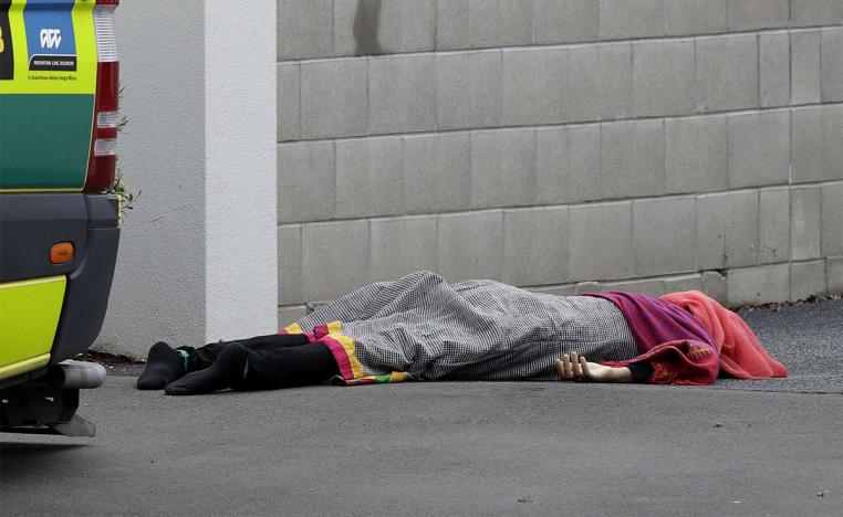A body lies on the footpath outside a mosque in central Christchurch