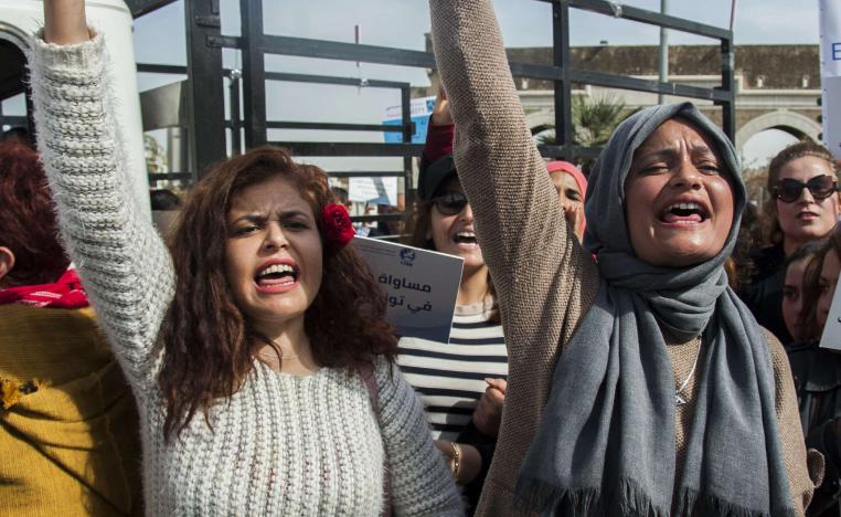 Tunisian women shout during a protest to ask for equality between men and women in Tunis, Tunisia, Saturday, March 10, 2018.