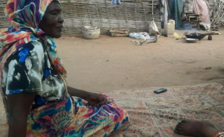 Kahdija, the daughter of Hawwa Yousef, sits in Kalma camp outside South Darfur state capital Nyala