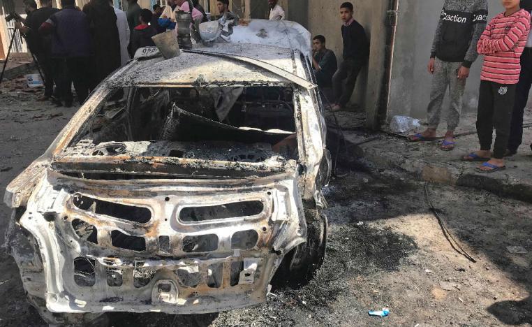 Libyans check a street in the capital Tripoli on April 17, 2019 in the aftermath of several rocket attacks the previous night