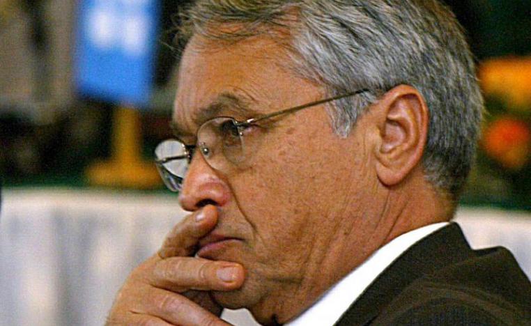 Then Algerian Energy Minister Chakib Khelil listens to the opening speech at the Organisation of Petroleum Exporting Countries (OPEC) meeting in Algiers, in this February 10, 2004 file photo