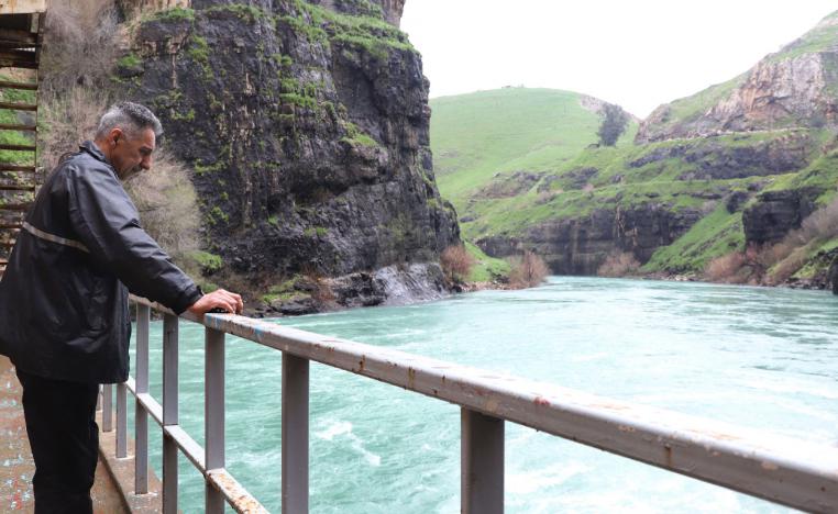 A man looks at the Dukan dam in Iraq's northern autonomous region of Kurdistan, five kms northwest of Suleimaniyah, which was built in 1955 and has reached its highest water levels following heavy rains in the region, on April 2, 2019.