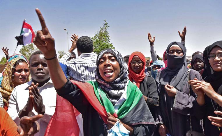 Sudanese demonstrators gather near the military headquarters in Khartoum