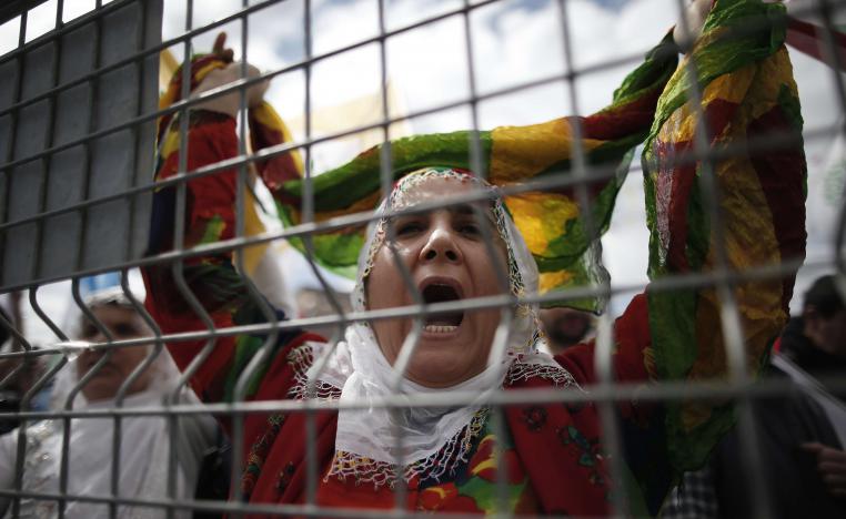 In this photo taken on Sunday, March 24, 2019, a woman shouts as thousands of supporters of pro-Kurdish Peoples' Democratic Party, or HDP, gather to celebrate the Kurdish New Year and to attend a campaign rally in Istanbul, ahead of local elections scheduled for March 31, 2019.