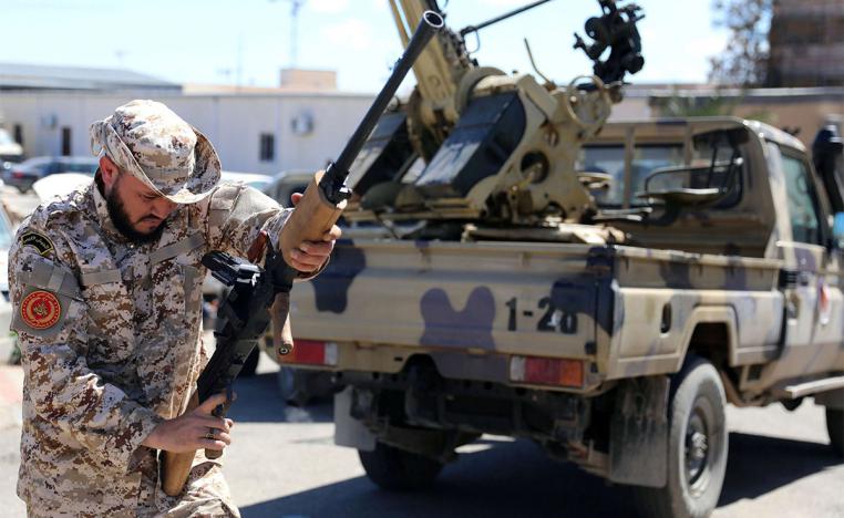 A Member of Misrata forces prepares himself to go to the front line in Tripoli