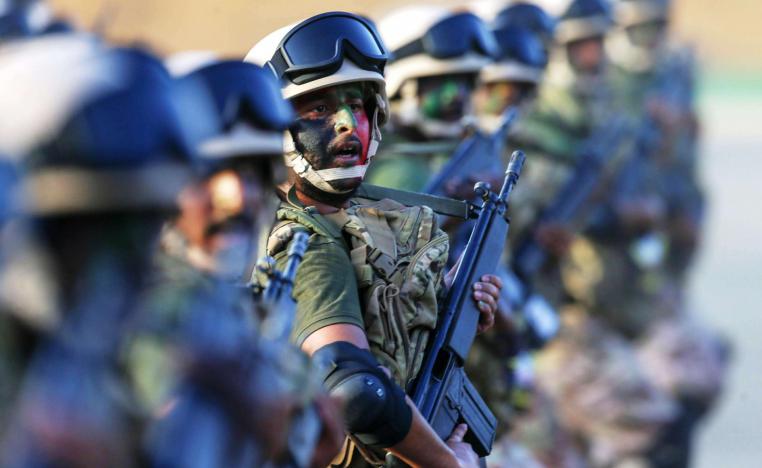 Online videos, which could not be immediately verified, showed a car at a checkpoint with its doors open and two bloody corpses splayed on the ground