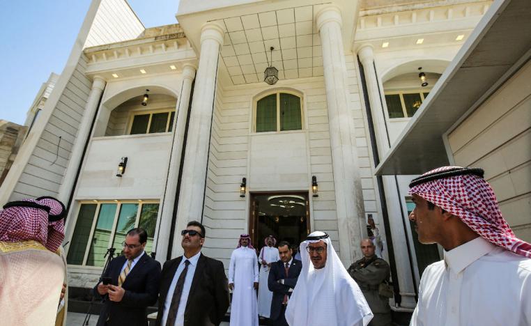 Saudi diplomatic staff are seen during the inauguration of the new Saudi consulate compound in the high security "Green Zone" in the centre of the Iraqi capital Baghdad on April 4, 2019.