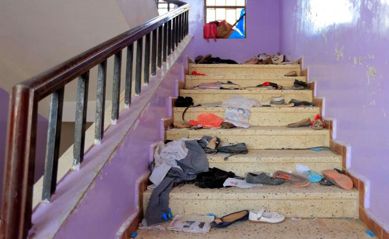 The belongings of Yemeni students are seen scattered on a staircase at a school in the capital Sanaa on April 7, 2019, following the deaths of 11 civilians including students in Yemen's capital.
