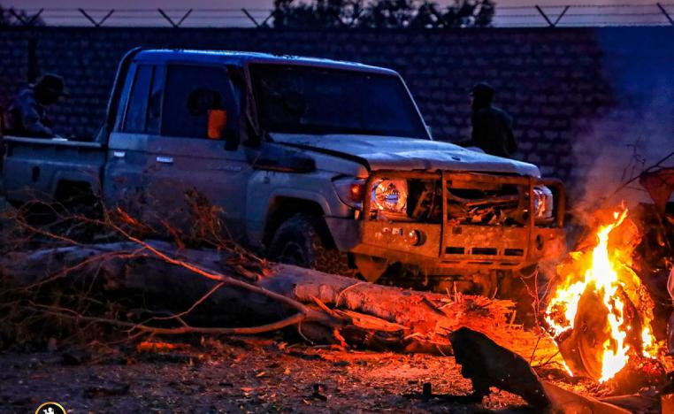 This image obtained from the Libyan strongman Khalifa Haftar's self-proclaimed Libyan National Army (LNA) War Information Division's Facebook page and released on April 10, 2019, reportedly shows a burning vehicle outside the 4th Brigade camp in al-Aziziyah, located some 40 kilometres south of the Libyan capital Tripoli.