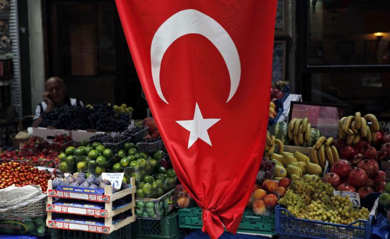 A shop owner waits for customers at a market in Istanbul