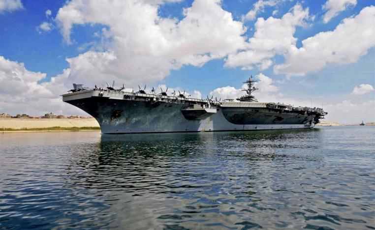 USS Abraham Lincoln sailing south in the Suez canal near Ismailia city east of Cairo