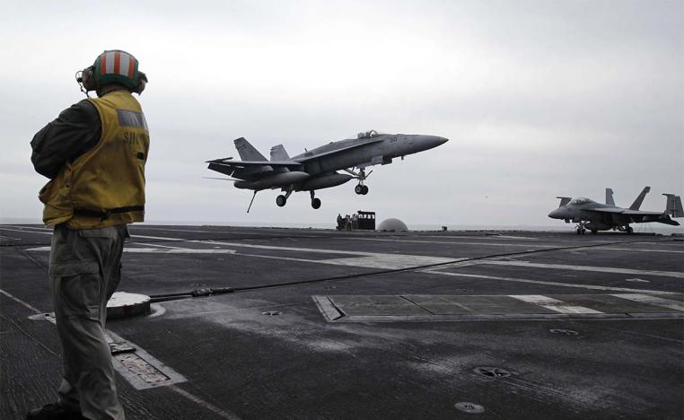 US fighter jet lands on the USS Abraham Lincoln aircraft carrier 