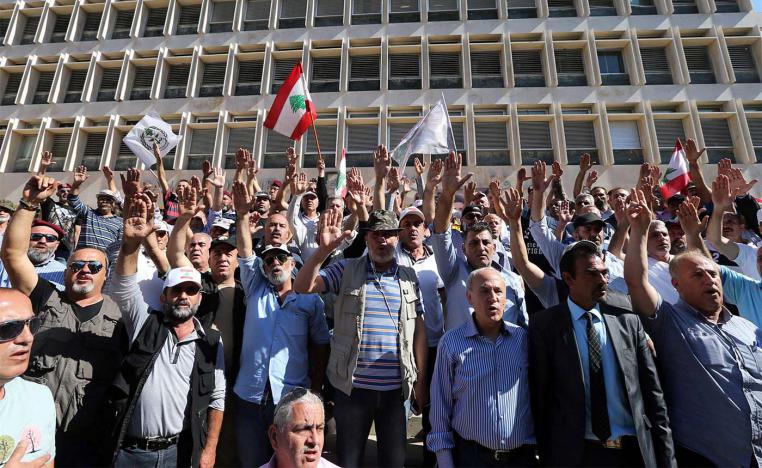 Retired Lebanese soldiers take part in a protest against draft state budget proposals