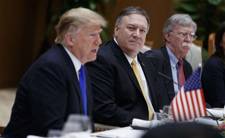 Secretary of State Mike Pompeo, center, and national security adviser John Bolton, right, listen to President Donald Trump 