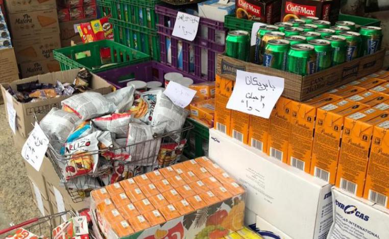 Food products nearing expiry on display at a market in Amman