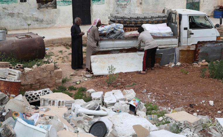 Syrians prepare to leave their houses in the village of Rabaa Jour