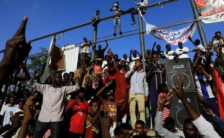 Hundreds walk each morning along the major boulevard that runs alongside the compound, the epicentre of the demonstrations that led to Bashir's downfall