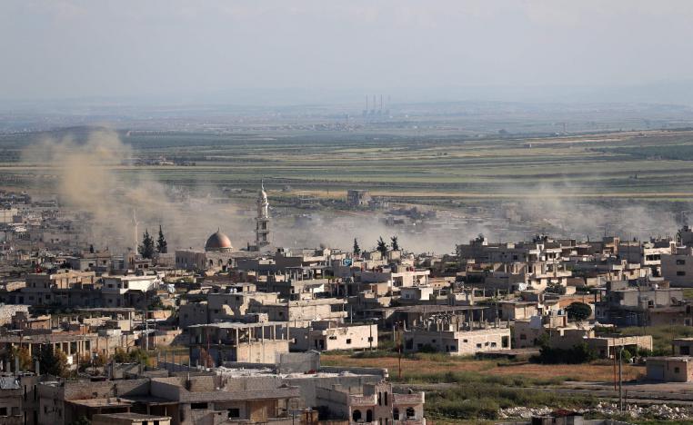 Plumes rising from shelling by government forces on the town of Khan Sheikhun