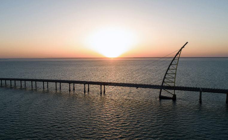Sunset view of the arch pylon on the Sheikh Jaber al-Ahmad Al-Sabah Causeway which will lead to the Future Silk City
