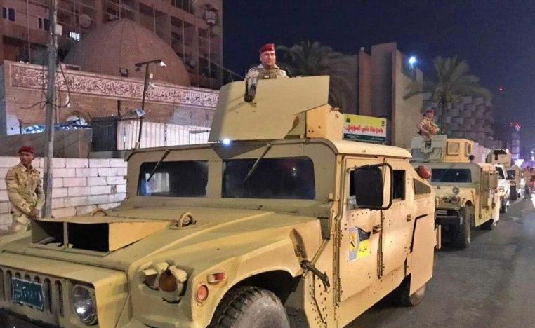 Iraqi security forces stand guard near Bahraini embassy in Baghdad