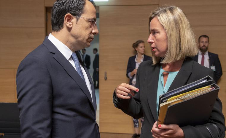 Cypriot Minister of Foreign Affairs Nikos Christodoulides (L) meets with European Union Foreign Policy Chief Federica Mogherini