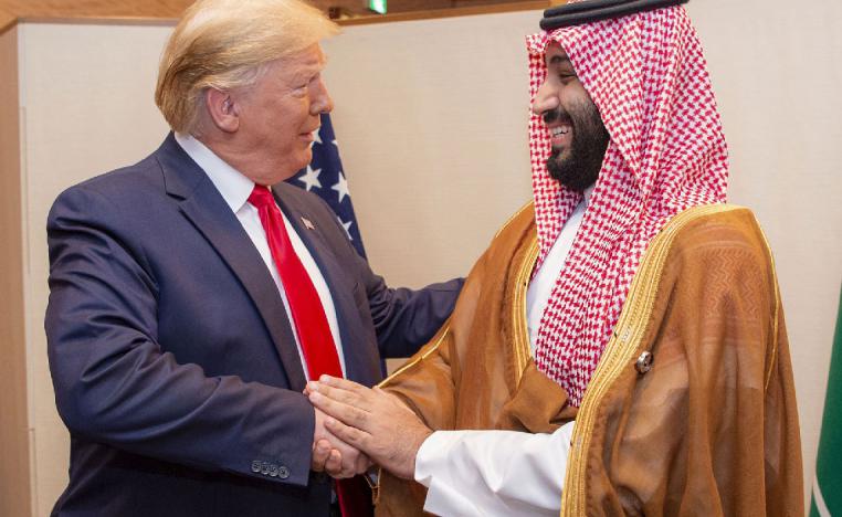 Saudi Crown Prince Mohammed bin Salman (R) shaking hands with US President Donald Trump during their meeting on the sidelines of the G20 Summit in Osaka, Japan