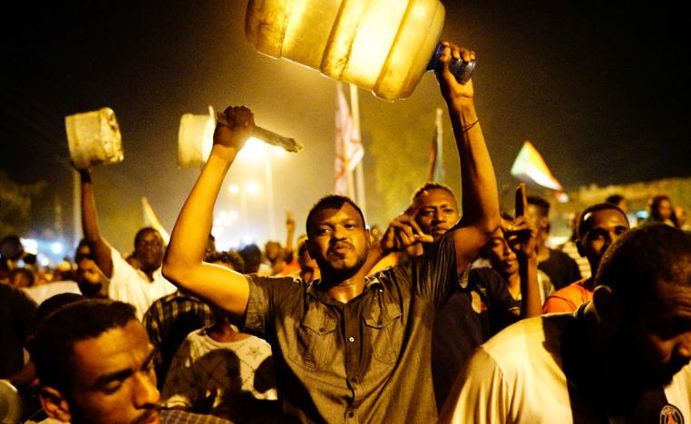 Sudanese people chant slogans during a demonstration in Khartoum