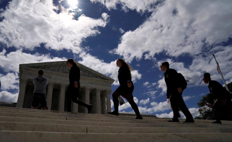 Students walk up the steps during a visit to the US Supreme Court in Washington