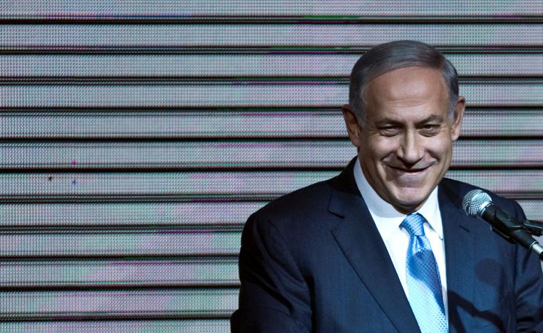 Israeli Prime Minister Benjamin Netanyahu delivers a speech to supporters at his party headquarters in Tel Aviv