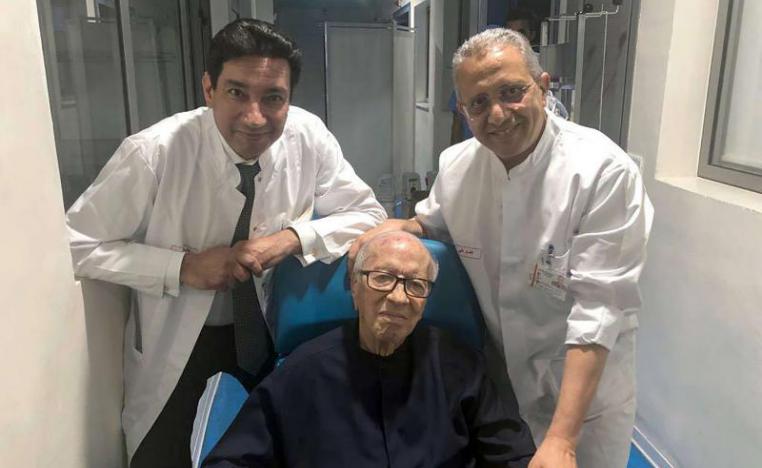 Tunisian President Beji Caid Essebsi surrounded by his doctors on July 1, 2019 before leaving the Tunis Military Hospital.